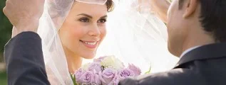 Wedding Photo - Bride's veil being opened