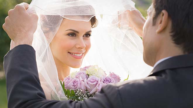 Wedding Photo - Bride's veil being opened
