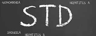 STD sign on a blackboard
